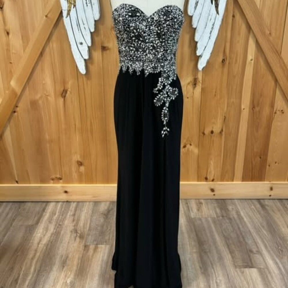 Black strapless dress with slit and rhinestone detailing on top portion of dress
